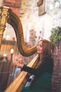 Ramona playing harp for a wedding at Dode
